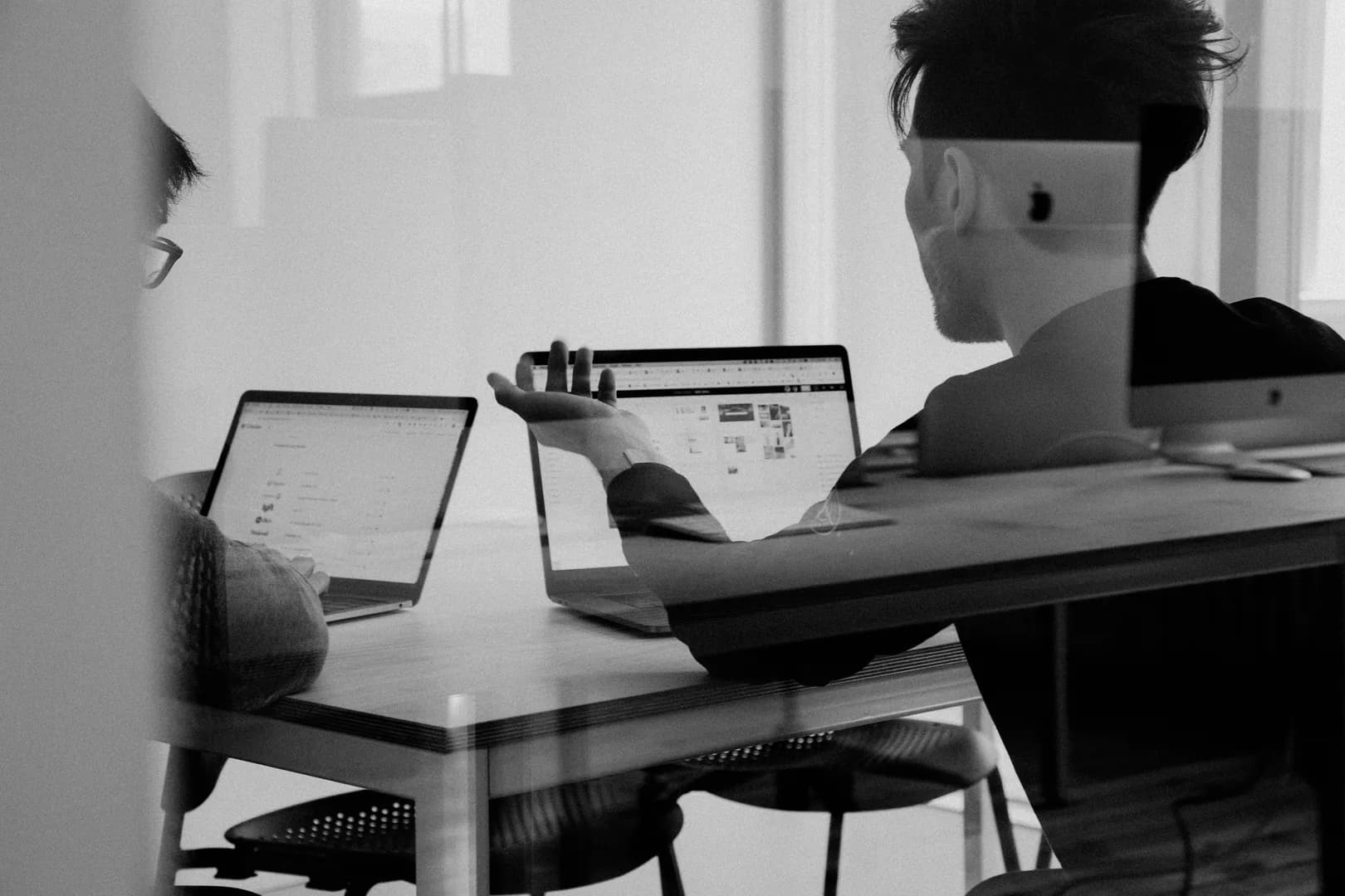A person reviewing design work on a laptop representing a professional portfolio presentation.